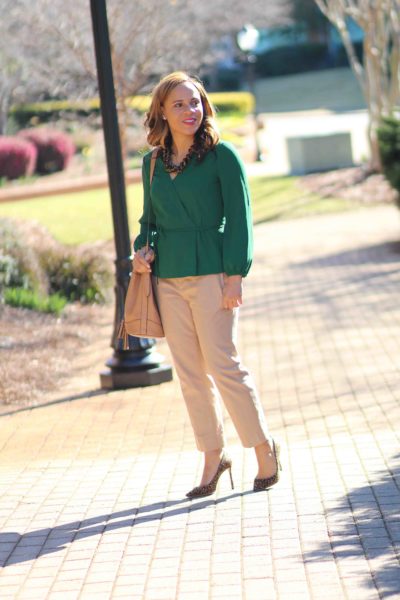 easy business casual outfit, green jcrew wrap top, old navy bucket bag, tan banana republic sloan pants, nicole to the nines. business casual outfit with tan pants