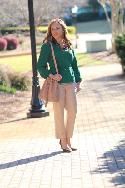 easy business casual outfit, green jcrew wrap top, old navy bucket bag, tan banana republic sloan pants, nicole to the nines. business casual outfit with tan pants