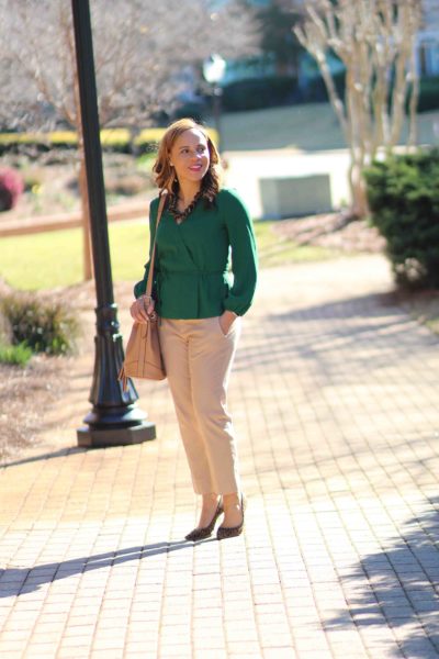 easy business casual outfit, green jcrew wrap top, old navy bucket bag, tan banana republic sloan pants, nicole to the nines. business casual outfit with tan pants